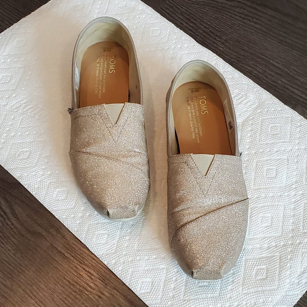 gold glitter TOMS shoes